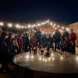group photo at a dark party with bright lights